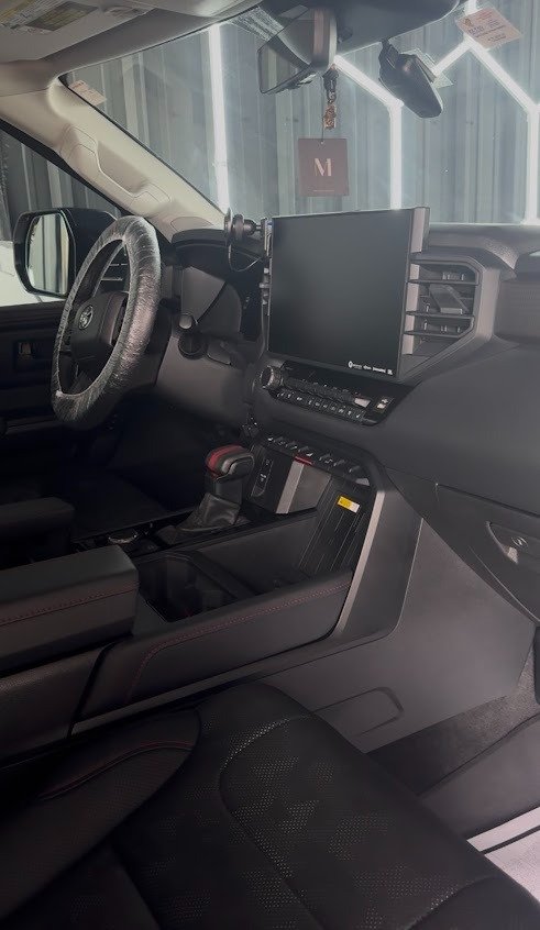 Freshly detailed truck cabin and console at Pineapple Autospa, Houston