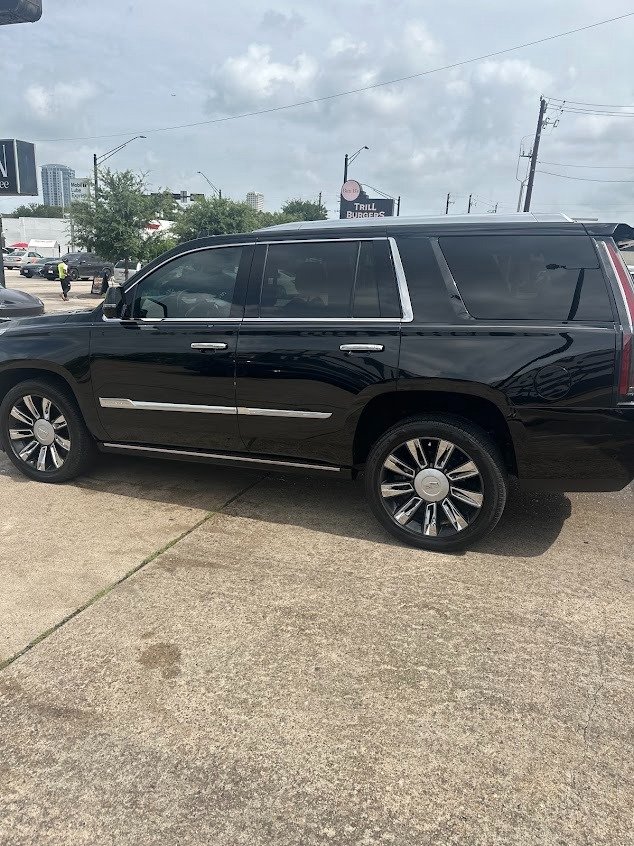 Black Escalade with dark window tint at Pineapple Autospa, Houston